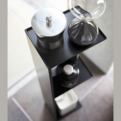 Aerial view of Yamazaki Home black Toilet Organizer holding bathroom items.