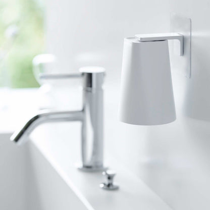 White Yamazaki Home traceless adhesive magnetic cup installed next to sink