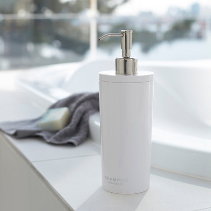 White Yamazaki Shampoo Liquid Soap Pump Dispenser near a sink.
