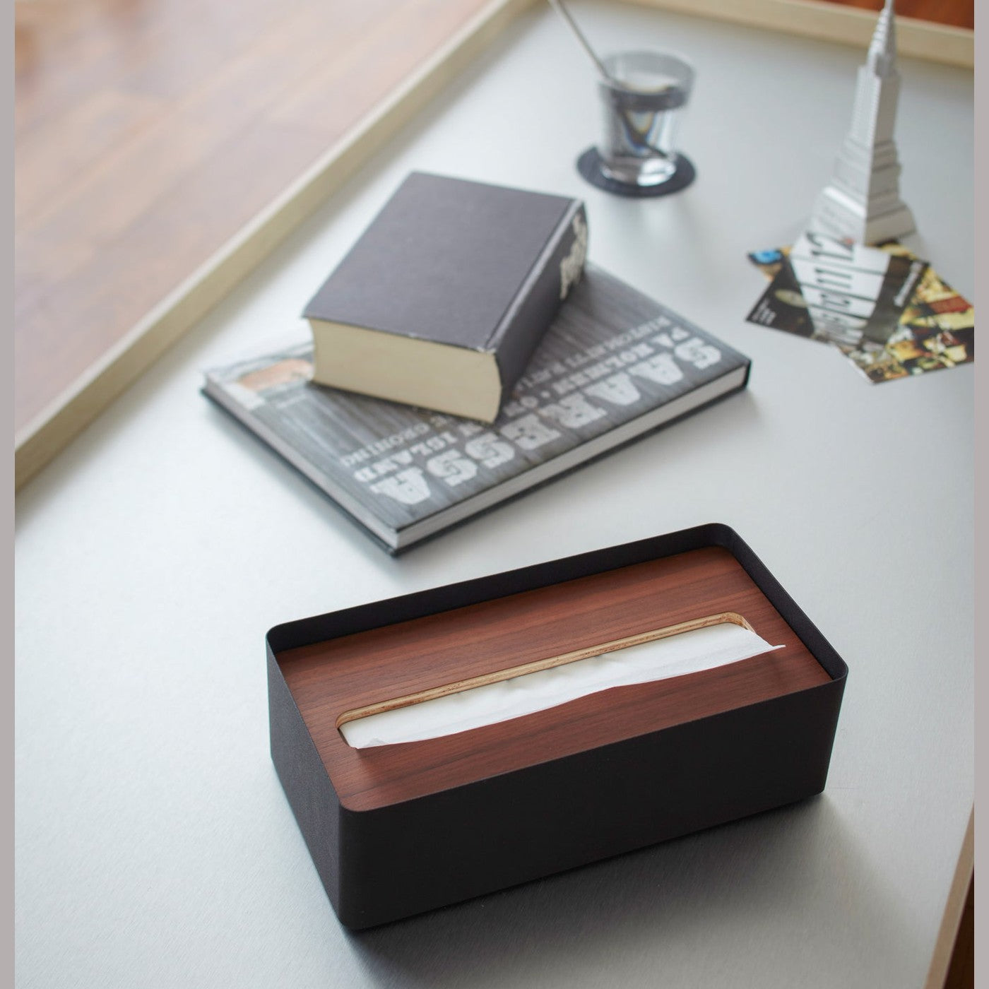 Aerial view of black Tissue Case on desk by Yamazaki Home.
