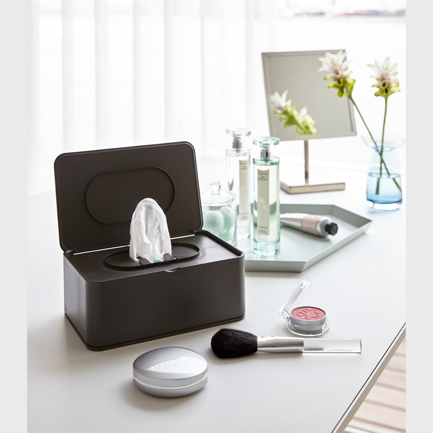 Black Wet Tissue Case on vanity countertop by Yamazaki Home.