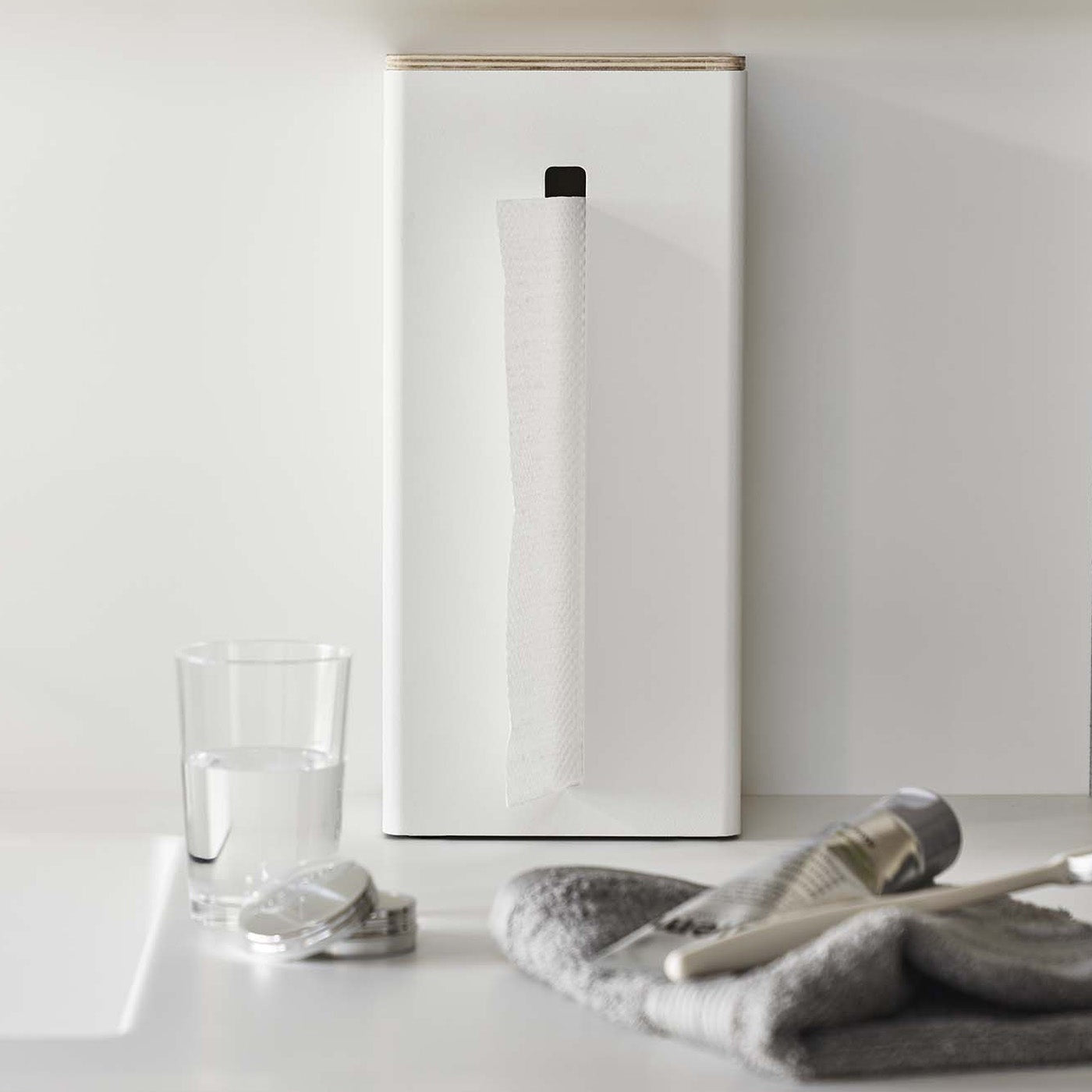 White Yamazaki Two-Sided Tissue Case stood up against a wall on a table