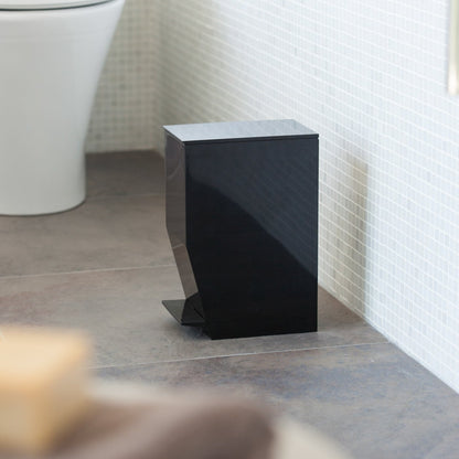Side view of black Step Trash Can in bathroom by Yamazaki Home.
