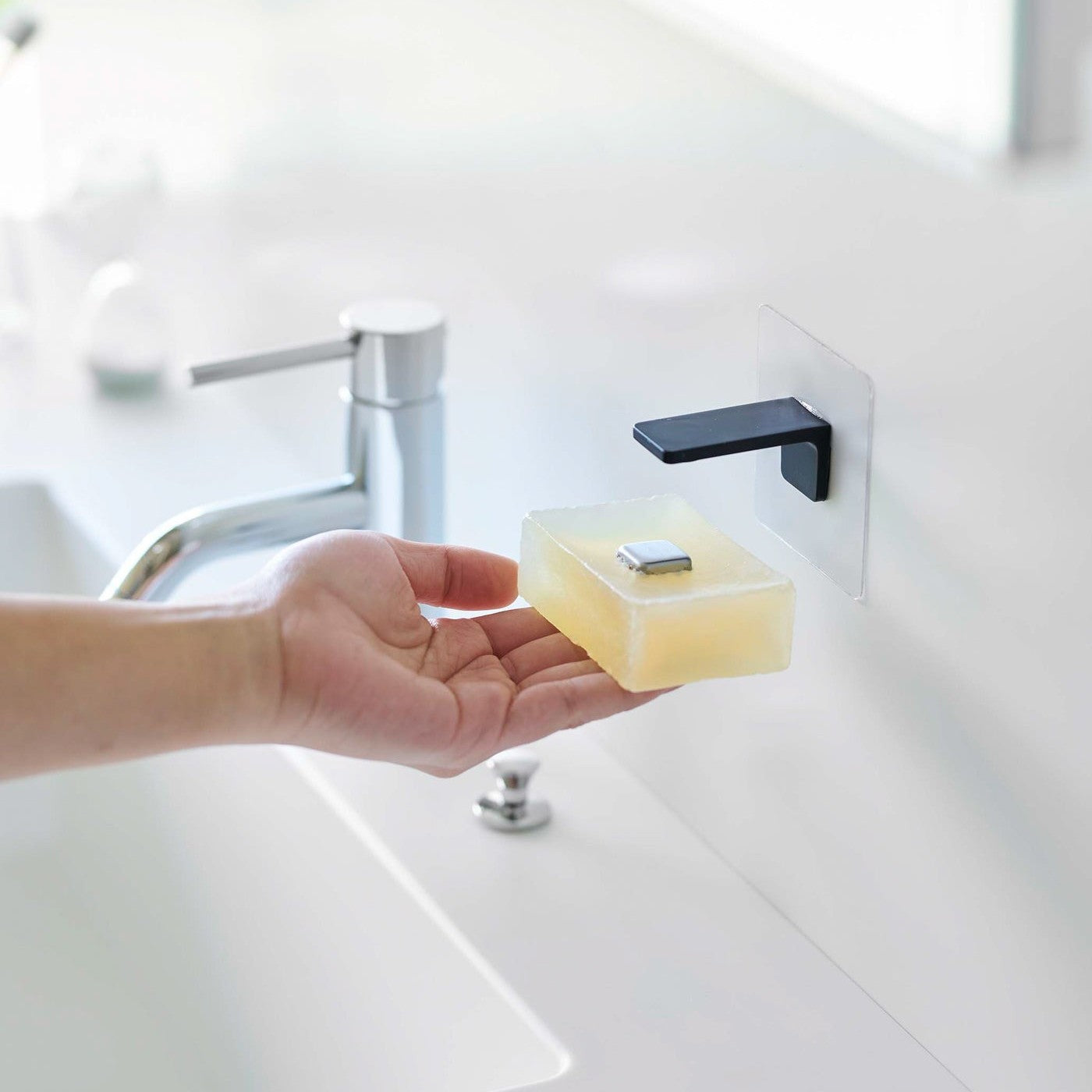 Taking out soap from black Yamazaki Home Magnetic Soap Holder