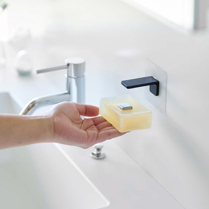 Taking out soap from black Yamazaki Home Magnetic Soap Holder