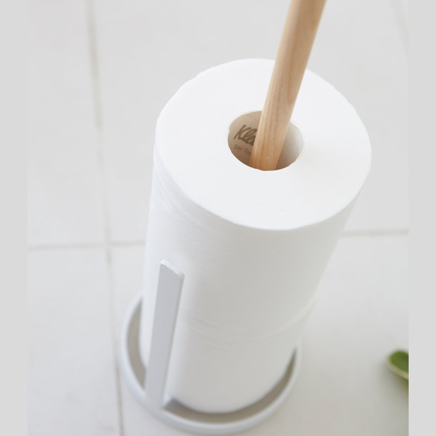 Close up aerial view of Toilet Paper Stocker holding toilet paper rolls on white background by Yamazaki Home.