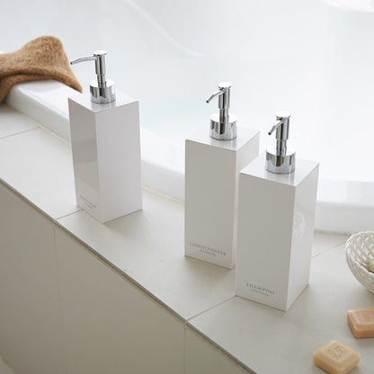 White Yamazaki Home square soap dispenser in three styles by bathtub