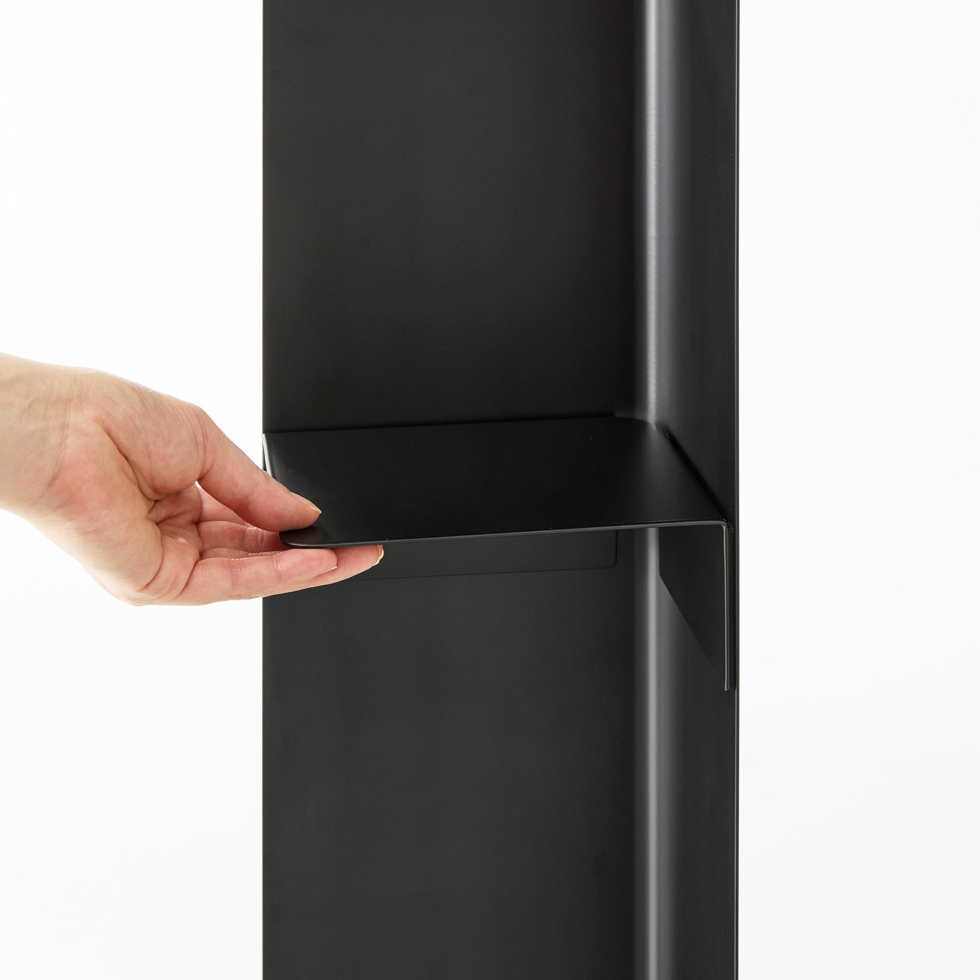 Black Yamazaki Home Rolling Bathroom Organizer magnetic divider attached to the base