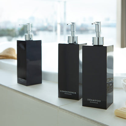 Black Yamazaki Home square soap dispenser in three styles by bathtub