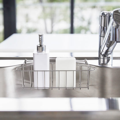 Front view of white Hand Soap Dispenser in kitchen sink by Yamazaki Home.