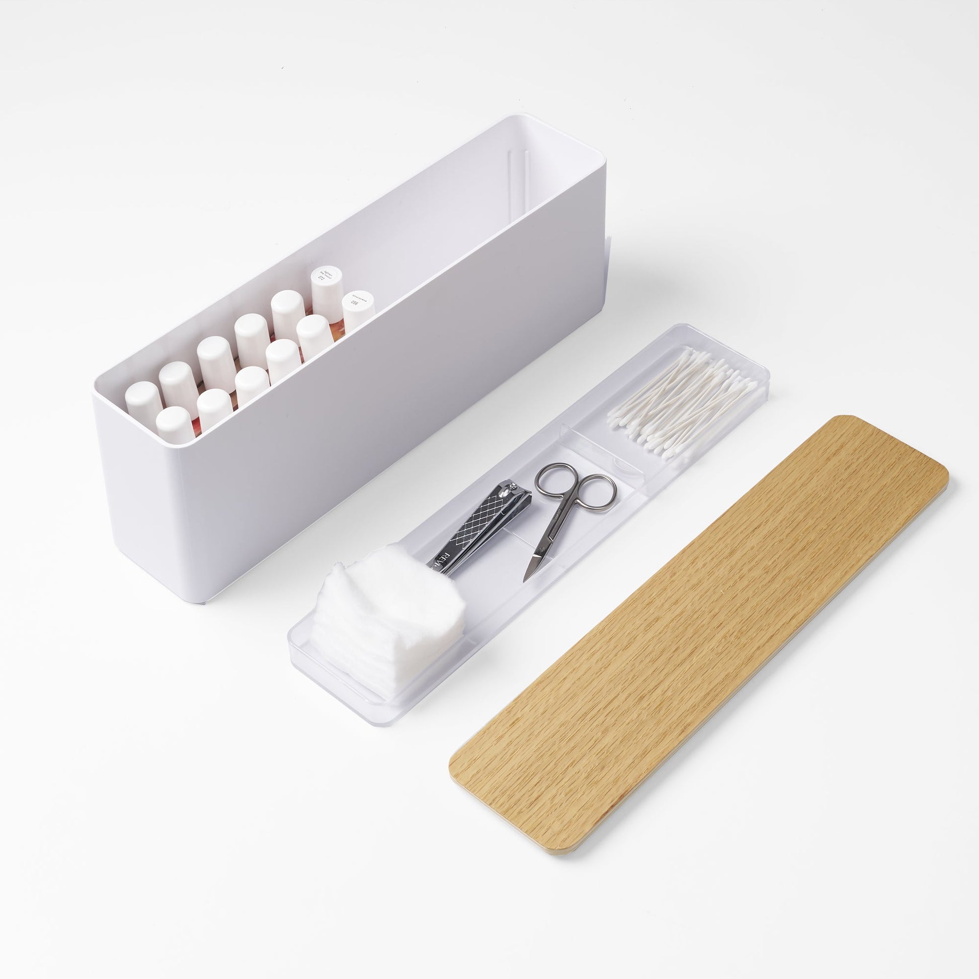 Yamazaki Home Nail Polish Organizer with props, set against a white background.