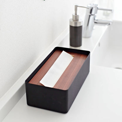 Aerial view of black Tissue Case on bathroom sink counter by Yamazaki Home.