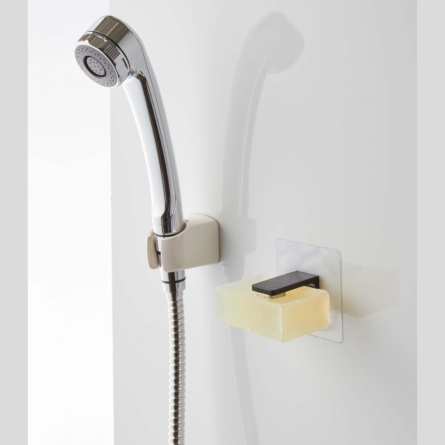 Black Yamazaki Home Magnetic Soap Holder installed next to shower head
