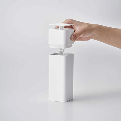 Front view of white One-Handed Push Soap Dispenser with top removed on white background by Yamazaki Home.