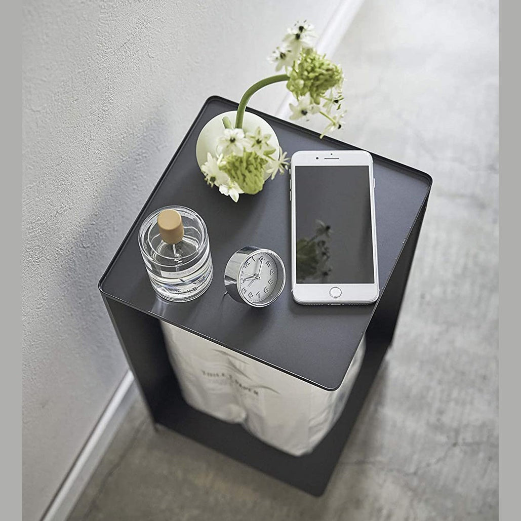 Aerial view of Black Rolling Bathroom Organizer with dÃÂ©cor on top and holding toilet paper in bathroom by Yamazaki Home.