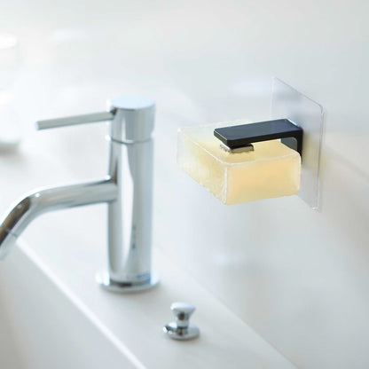 Black Yamazaki Home Magnetic Soap Holder installed next to sink