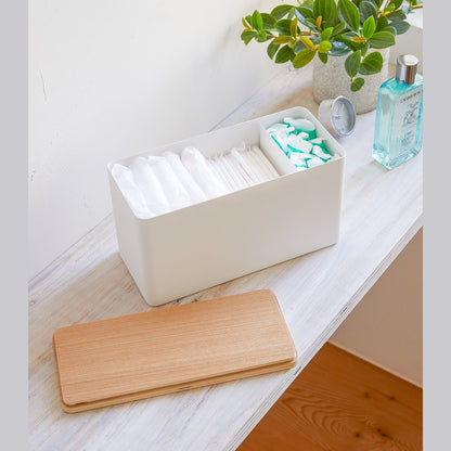 White Countertop Organizer holding diapers and products with cover off on shelf by Yamazaki Home.