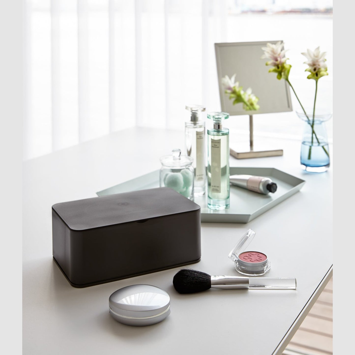 Black Wet Tissue Case on vanity counter by Yamazaki Home.