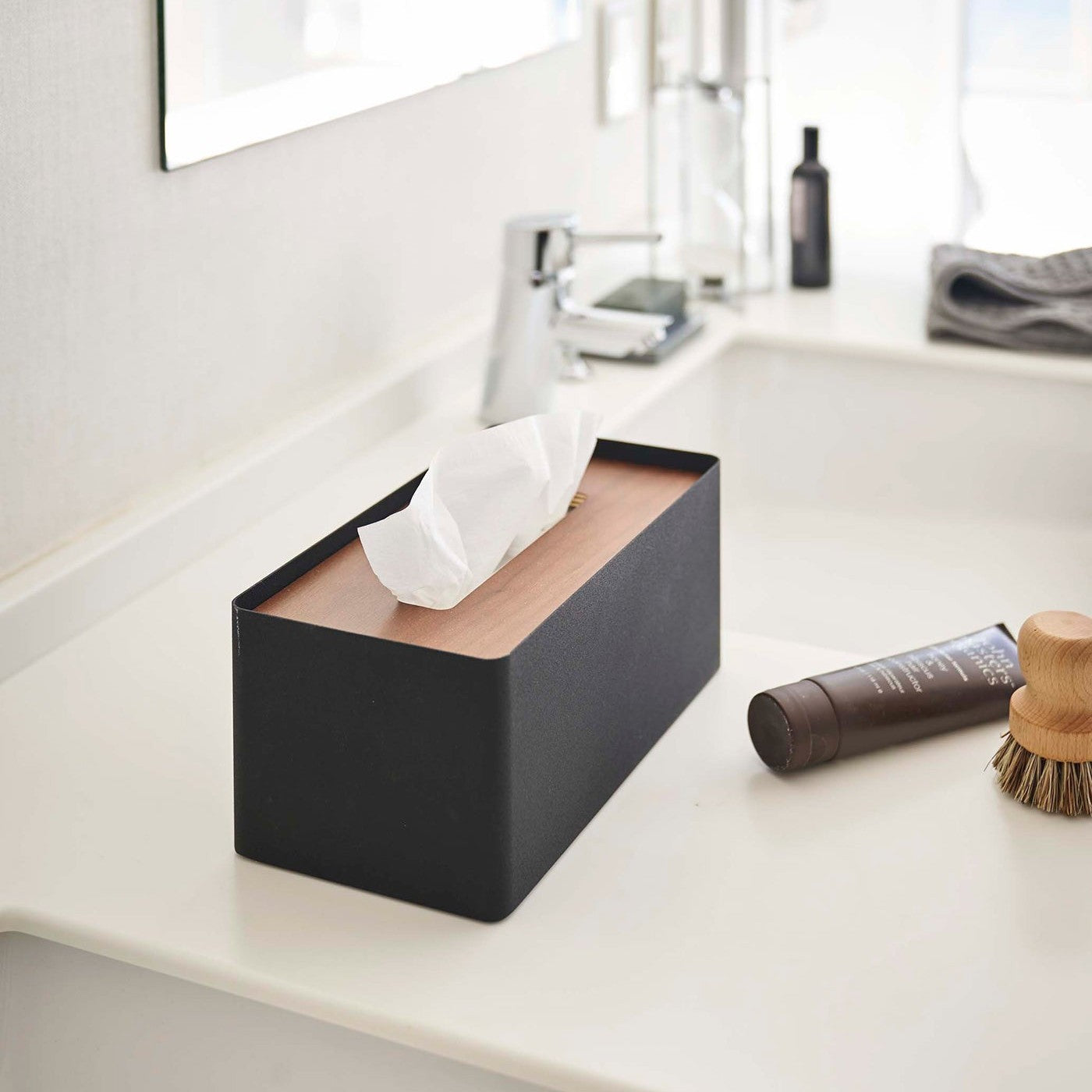 Black Tissue Case with lid off holding tissues by Yamazaki Home.