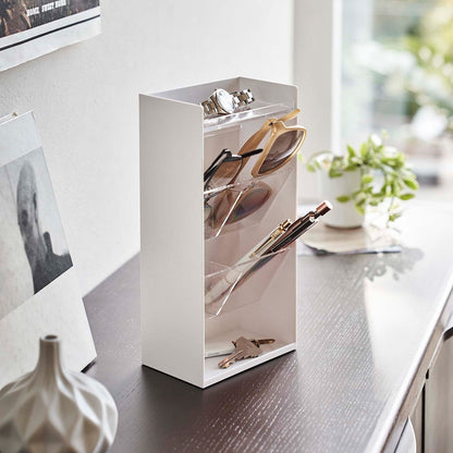 White Yamazaki Home Accessory Organizer holding accessories such as pens and a watch