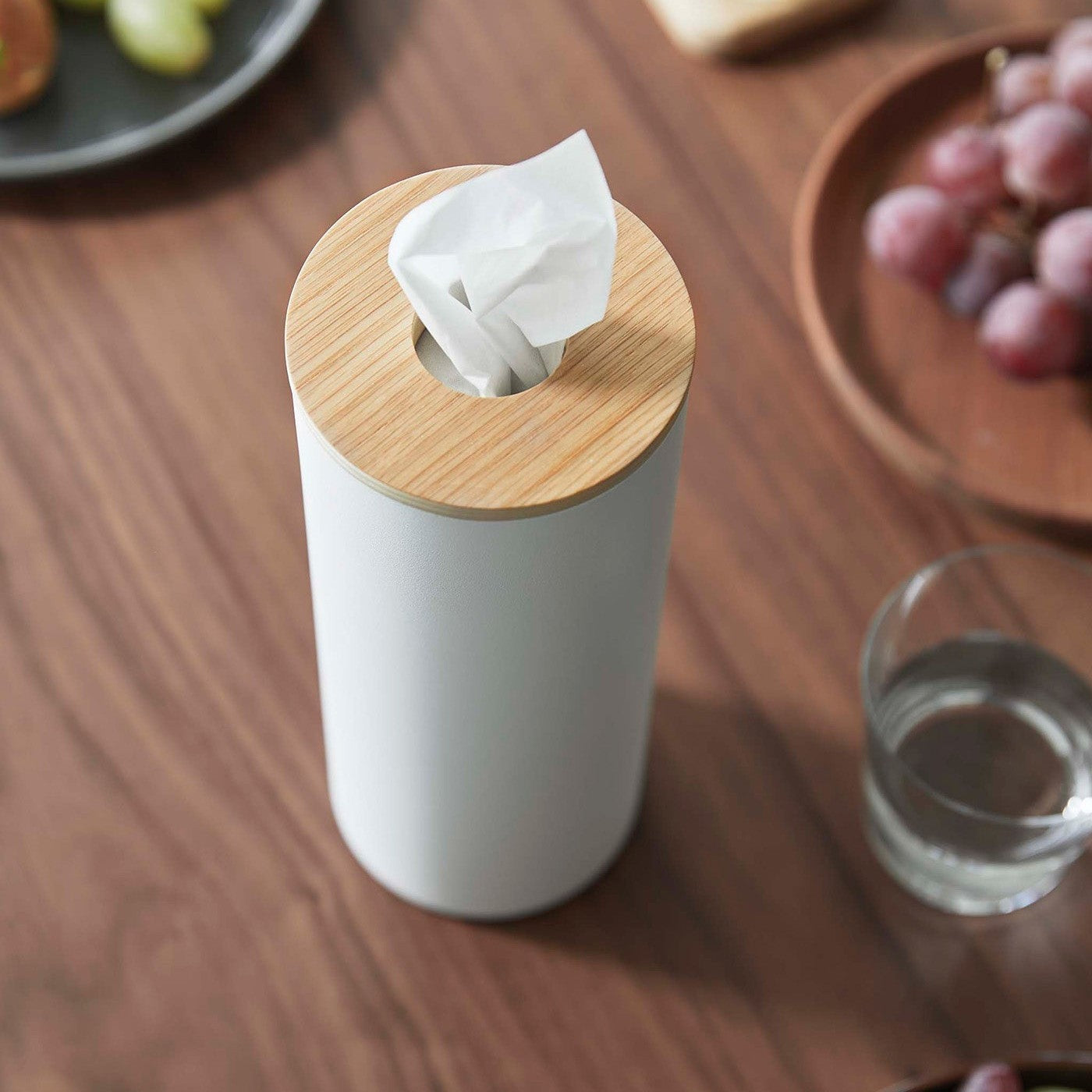 Close up of Large White Yamazaki Home Round Tissue Case on a dining table