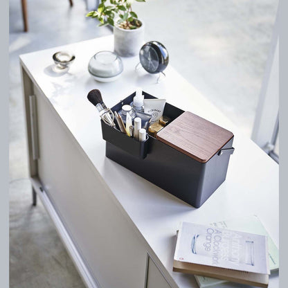 Closed black Makeup Organizer holding makeup products on table by Yamazaki Home.